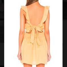 Brand New With Tags. Size Small. Free People Mini Dress With Ruffles And A Tie In The Back. Color Is Called “Sun Yellow” But Is More Of An Orange. Perfect Condition. (Bin 1) Yellow Mini Dress For Casual Wear, Yellow Tie-back Dress For Vacation, Yellow Mini Sundress For Date Night, Casual Backless Sundress With Ruffles, Casual Backless Ruffled Sundress, Fitted Yellow Sundress For Casual Wear, Fitted Yellow Sundress For Casual Occasions, Yellow V-neck Mini Dress For Casual Wear, Yellow V-neck Mini Dress For Dress Down Occasions