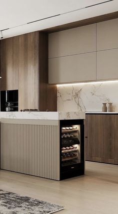 a modern kitchen with marble counter tops and wooden cabinets