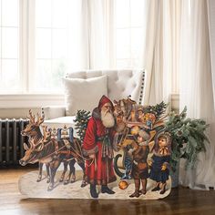 a christmas scene with santa claus and his reindeers on the floor in front of a window