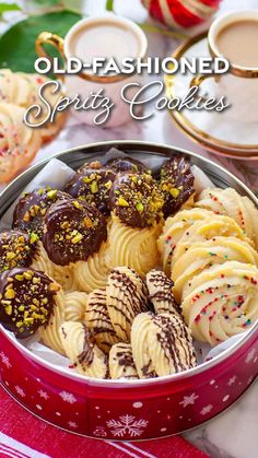 an old fashioned cookie tin filled with cookies and sprinkles on a table