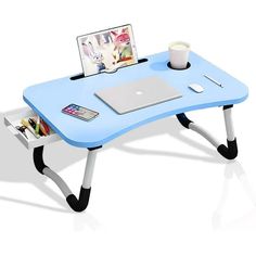 a blue table with a laptop on it and a cup of coffee next to it