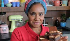 a woman in a red shirt is holding some desserts