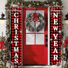 a red door decorated with christmas decorations and wreaths