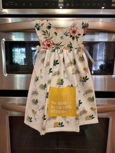 a dress hanging on the oven door with words we wish to be doing others written on it