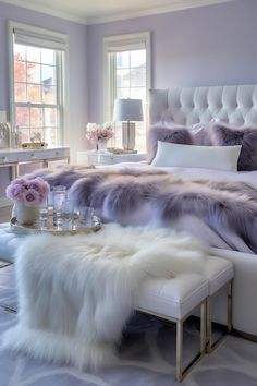 a bedroom with purple walls and white fur on the bed, along with two side tables