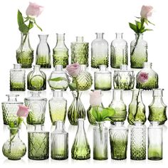 many green vases with pink roses in them on a white background, one is empty