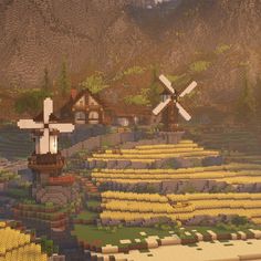 an image of a farm scene made out of legos with windmills in the background