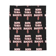 a black towel with the words born to be buckeye on it and an image of a