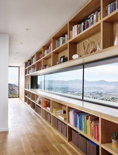 the bookshelves are full of books and there is no image on them in this room