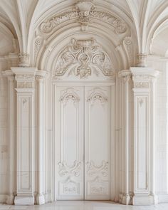 an empty room with white walls and columns