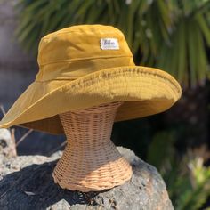 "A yellow wide brim corduroy sun hat for beach days and sunny day fun.  This sun hat for women has a nice wide brim to protect your whole face and even your neck and chest.  Easy to bring along in your bag, folds up easy.   This hat is made from a mustard yellow cotton corduroy fabric.  Inside liner is white cotton.  I used interfacing inside the brim to keep it's shape. Brim measures 4.5\" Crown depth is 3.5\". Contact me for custom fit option. SIZES AVAILABLE S - measures 22.5\" (fits heads wi Cute Yellow Bucket Hat, Cheap Fun Yellow Bucket Hat, Large Brimmed Hats, Cheap Yellow Festival Hat, Yellow Cotton Wide Brim Bucket Hat, Yellow Wide Brim Cotton Bucket Hat, Casual Yellow Bucket Hat, Yellow Cotton Hat For Outdoor, Yellow Bucket Hat For Outdoor Summer Activities