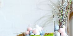 a vase filled with eggs sitting on top of a table next to another vase full of eggs