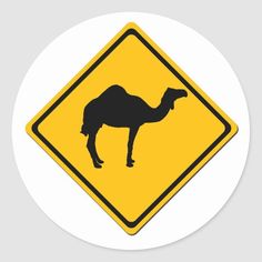 a yellow and black camel crossing sign sticker