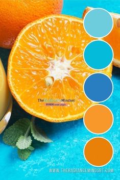 an orange and some other fruit on a blue surface with the color guide below it