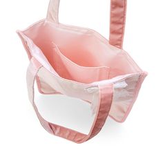 an open pink bag sitting on top of a white table