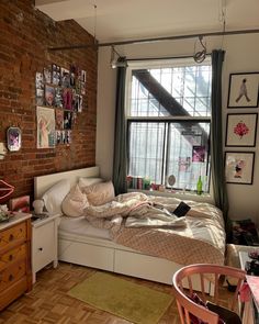 a bed room with a neatly made bed next to a window