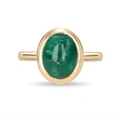 A bezel-set emerald cabochon ring in 14K yellow gold. Featured here is this lovely 3.82-carat natural, earth-mined, emerald cabochon. This stone displays a gorgeous, dark green color, and very good luster. This natural beauty is set in a 14K yellow gold bezel setting. Setting Style: Bezel / Solitaire Setting Material: 14K Yellow Gold Gold Weight: 4.9 Grams Main Stone: Emerald Cabochon Shape: Oval Cut Weight: 3.82-Carats Clarity: Translucent Color: Dark Green Luster: Very Good Origin: Zambia Trea Fine Jewelry Emerald Ring With Oval Cabochon, Fine Jewelry Emerald Oval Cabochon Ring, Yellow Gold Emerald Ring With Oval Cabochon, Yellow Gold Emerald Ring Oval Cabochon, Heirloom Oval Cabochon Emerald Ring, Emerald Bezel Set Oval Cabochon Ring, Green Emerald Ring With Oval Cabochon Bezel Setting, Oval Emerald Ring With Bezel Setting, Cabochon Emerald Ring Gift