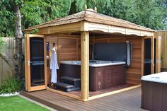 a hot tub sitting on top of a wooden deck