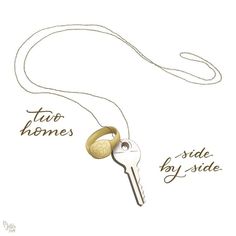 a key is attached to a necklace with the words, two homes side by side