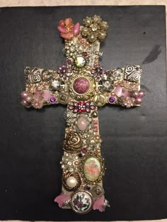 a cross made out of beads and other items