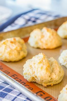 some biscuits are on a baking sheet and ready to be baked in the oven or used as an appetizer