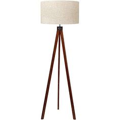 a wooden tripod floor lamp with a white shade