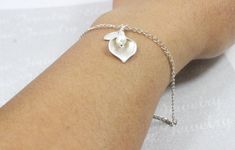 A beautiful, feminine, eye catching Silver Calla Lily Bracelet. A must have. This impressive Silver Calla Lily Bracelet would make a great Holiday gift .lady present, a best personalized gift for a wife, girlfriend, mom of one, sister, friend, yourself for just everyday necklace. --925 sterling silver --Lily charm measures 19x23mm and features gold or silver plating --Hand engraved Leaf with your choice of lettering -- Fresh water pearl This Silver Calla Lily Bracelet. created and hand crafted w Calla Lily Jewelry, Lily Bracelet, Lily Jewelry, Everyday Necklace, Fresh Water Pearl, Calla Lily, Bracelet Silver, Dainty Jewelry, Gift Wedding