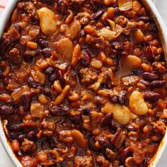 a casserole dish filled with beans and meat