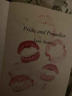 an open book with lipstick imprints on it's cover and the title pride and providence written in red