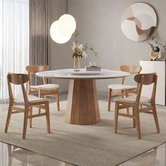 a dining table with four chairs around it