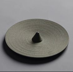 an object is shown on a gray surface