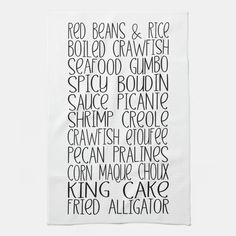 a tea towel with the words king and queen written in black ink on white paper