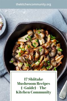 a skillet filled with mushrooms on top of a table