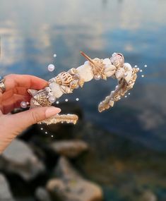 This beautiful crown has natural seashell with pearl rhinestones at the center with tiny ivory flower vines and a string of pearls woven throughout. This seashell crown would make a great accessory for a beach wedding or beach themed party! This elegant looking seashell headpiece is made of real sells - flexible design - one size fits all - a high quality handmade headband - perfect in wedding for brides, bridesmaids or proms, - a natural looking wreath makes you look elegant and stand out - the Seashell Clothing, Seashell With Pearl, Seashell Headpiece, Seashell Tiara, Mermaid Tiara, Seashell Headband, Seashell Crown, Shell Crowns, Beach Mermaid