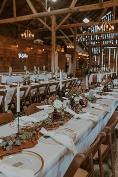 the tables are set with white and gold place settings