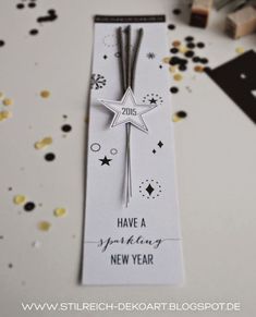 a new year's card on a table with confetti