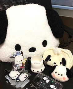 the stuffed animal is sitting next to other items