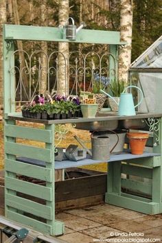 an outdoor potting station with pots and plants