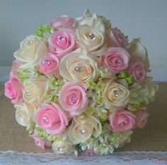 a bridal bouquet with pink and white flowers