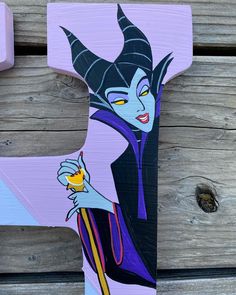 the letter h is painted with an image of evil queen