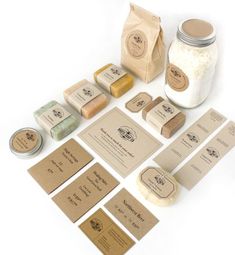 several different types of spices and labels on a white surface with brown paper tags attached to them