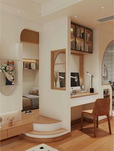 a living room filled with furniture next to a wooden table and bookshelf on top of a hard wood floor