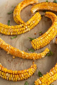 grilled corn on the cob with herbs and seasoning sprinkles