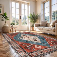 a living room filled with furniture and lots of window sills on top of wooden floors