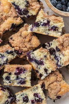 blueberry crumb muffins cut in half and stacked on top of each other