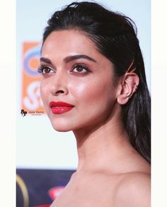 an image of a woman with red lipstick on her face and hair in ponytails