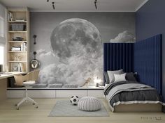 a bedroom with a large moon mural on the wall and a desk in front of it