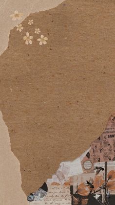 a collage of various items and flowers on a piece of brown paper with torn edges