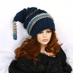 "Make winter fun with this chunky thick warm mountain ski snow hat. A little witchy, a bit of elf, and dark blue in color. I've crocheted this with bands of contrasting color and ridges. 21\" long from the top to the brim with a matching corkscrew tip, this hat is soft and can be shaped, tucked, or worn straight out. Certain to add character to your outdoor wear or gift to a friend who just loves fun things. Lots of stretch, so one size will fit most. Machine wash cold, lay flat to dry." Whimsical Adjustable Winter Hat, Whimsical Winter Hats Adjustable Fit, Whimsical Winter Hats With Adjustable Fit, Whimsical Winter Hats Adjustable, Whimsical Brimmed Winter Bonnet, Whimsical Adjustable Winter Bonnet, Whimsical Wide Brim Winter Hat, Whimsical Winter Bonnet With Adjustable Fit, Whimsical Winter Hat