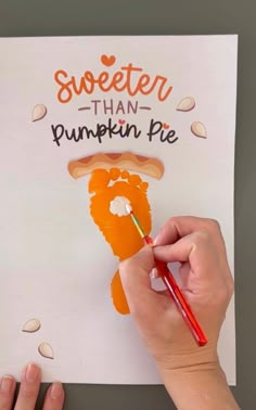 someone is painting a piece of paper with the words sweeter than pumpkin pie on it